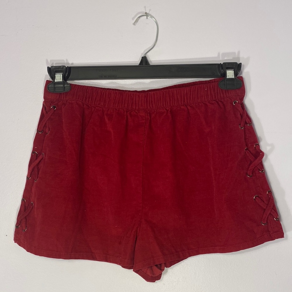 Red laced up side shorts with tag.